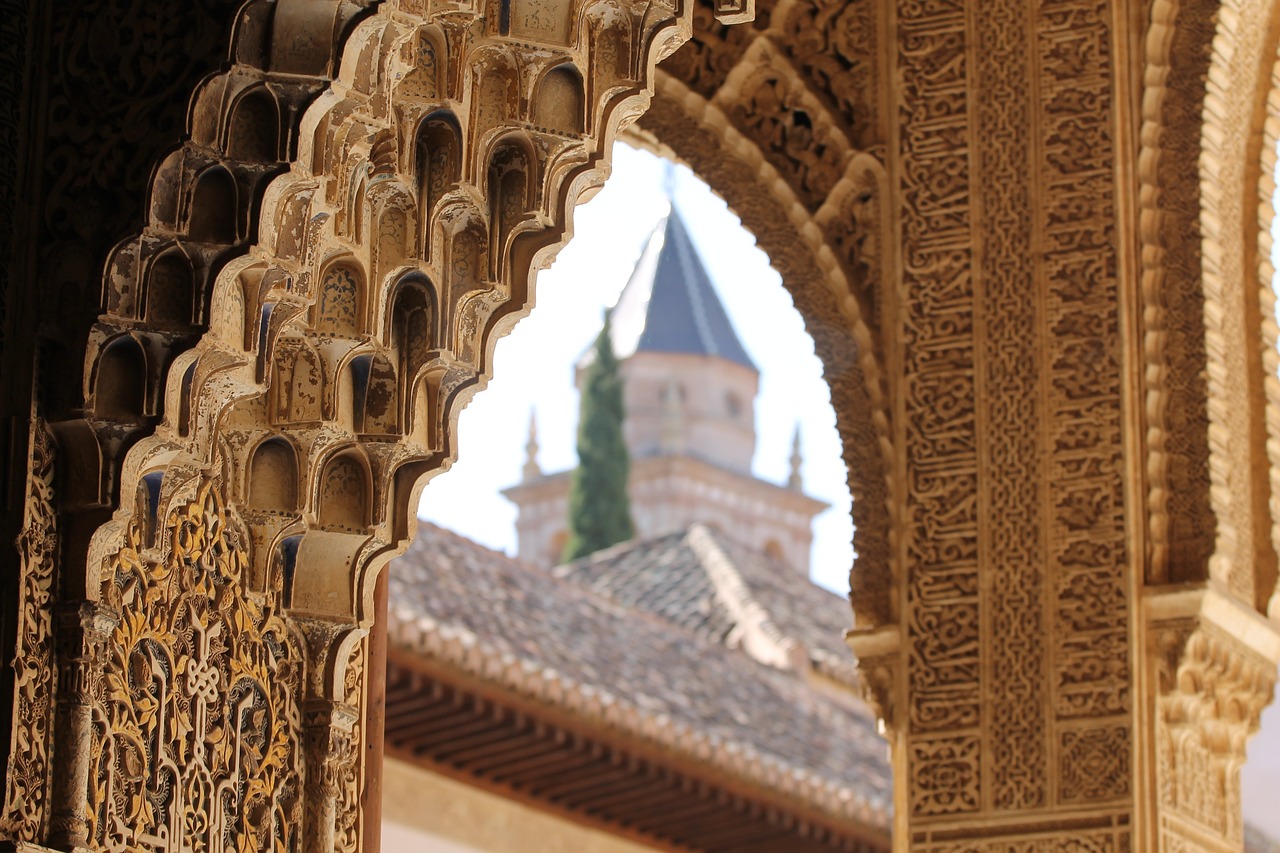 The Alhambra of Granada, showcasing its stunning architecture and beautiful gardens, a historical jewel of Spain.
